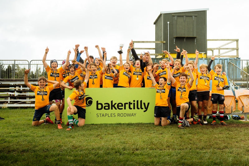 Zone team celebrates with the trophy at Clifton